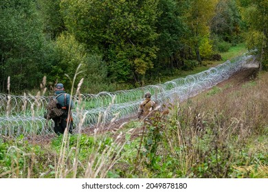Indra, Latvia - September 28, 2021: Latvia - Belarus border, where Latvian State Border Guard and army begins to install a barbed wire fence