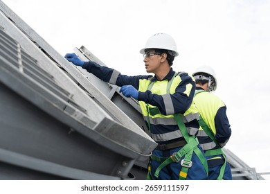 Induced draft cooling towers. Engineer or technicians maintenance and repair of cooling towers on rooftop of building