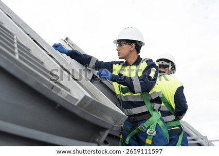 Induced draft cooling towers. Engineer or technicians maintenance and repair of cooling towers on rooftop of building