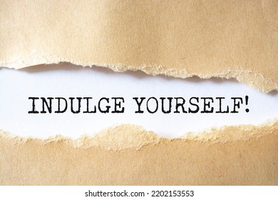 Indulge Yourself Message Written Under Torn Paper.