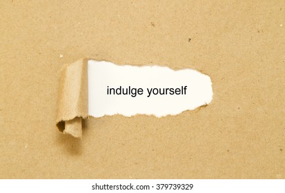 Indulge Yourself Message Written Under Torn Paper. 