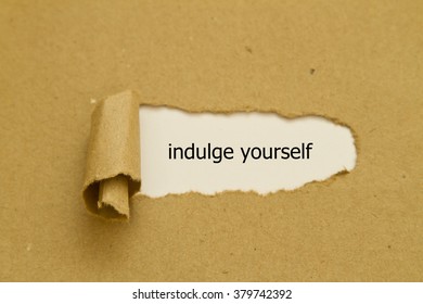 Indulge Yourself Message Written Under Torn Paper. 