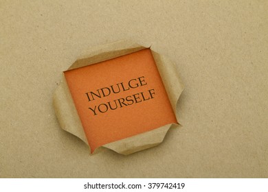 Indulge Yourself Message Written Under Torn Paper. 