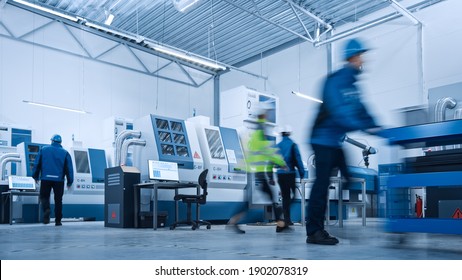 Indusry 4.0 Factory: Blurred Motion Shot of a Team of Engineers, Professionals and Workers, Working on Assembly and Production Line, Optimizing CNC Machinery, Programming Machines. - Powered by Shutterstock