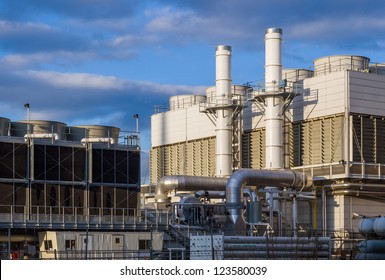 Industiral Cooling Plant In Late Afternoon With Blue Sky