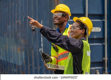 industrail background of african american containers yard and cargo inspector team working at containers loading area