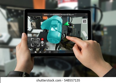 Industrial 4.0 , Augmented reality concept. Hand holding tablet with AR service , maintenance application and calling technician for check destroy part of smart machine motor in smart factory