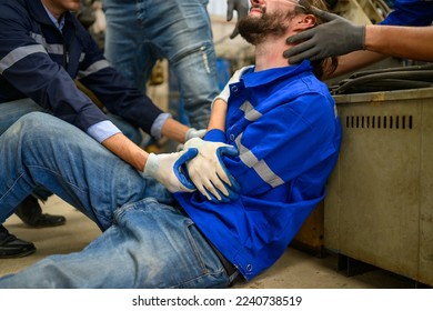 Industrial Accident. worker with accident from machine factory - Shutterstock ID 2240738519