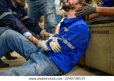 Industrial Accident. worker with accident from machine factory