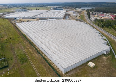 Industrial agricultural greenhouses for growing vegetables. Aerial view	. - Powered by Shutterstock