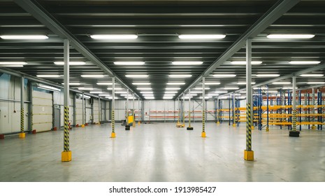 Industrial Architecture. Modern Interior Of Huge Empty Storehouse. New Distribution Warehouse With Rack Stack. Metal Construction.