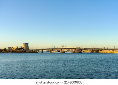 Industrial Area Of Port Adelaide With The Bridge Across The Port River At Sunset, South Australia