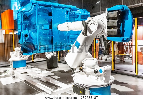 \
Industrial automated robotic arm working in car\
factory
