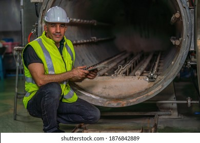 industrial background of food factory engineer with safety vest and helmet checking steam retort using for food products sterilization get ready to use for food processing - Shutterstock ID 1876842889