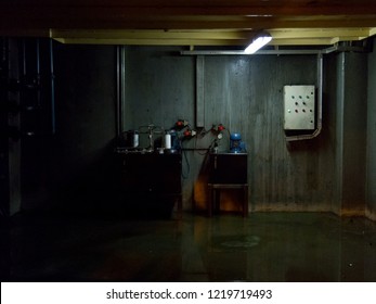 Industrial Basement With Wet Floor. Dark Gloomy Ambient Terror Movie Concept 