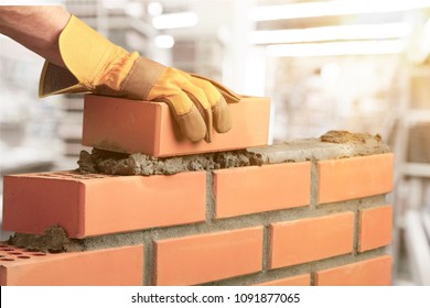 Industrial bricklayer installing bricks