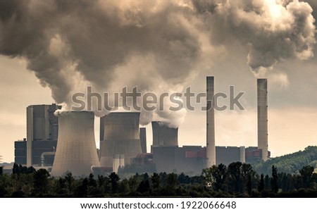 Industrial brown coal power plant chimney smokestack emission.