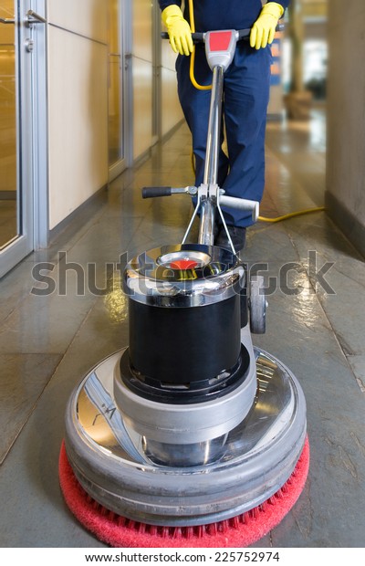 Industrial buffing machine polishing the floor in
a hallway