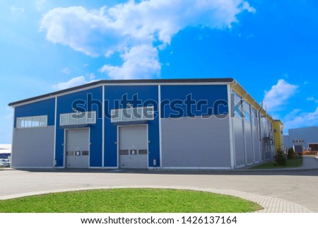 Industrial building against the blue sky. Factory