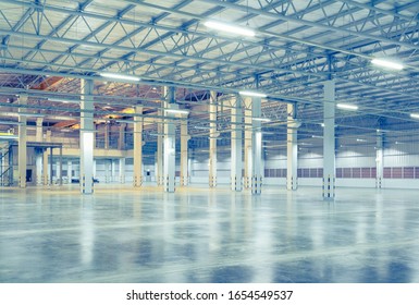 Industrial Building Or Modern Factory For Manufacturing Production Plant Or Large Warehouse, Polished Concrete Floor Clean Condition And Space For Industry Product Display Or Industry Background.