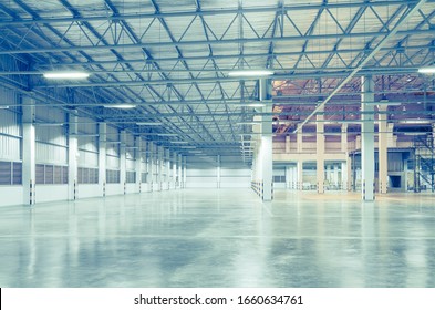 Industrial Building Or Modern Factory For Manufacturing Production Plant Or Large Warehouse, Polished Concrete Floor Clean Condition And Space For Industry Product Display Or Industry Background.