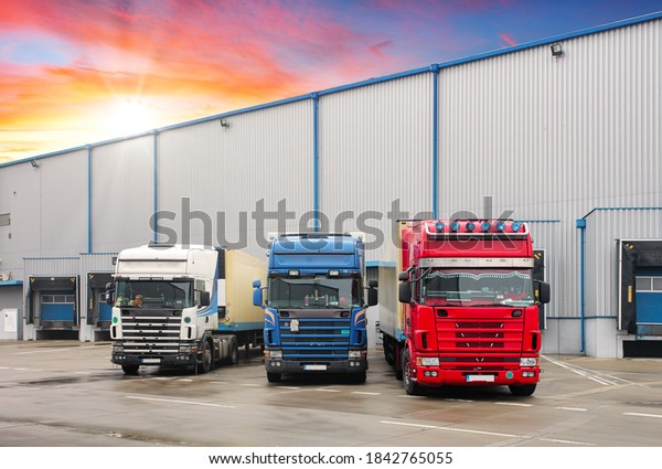 Industrial building and warehouse with freight\
trucks - Logistic