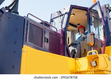 Industrial Bulldozer Driver Gets Into Coal Loading Cab In Open Pit Mine.