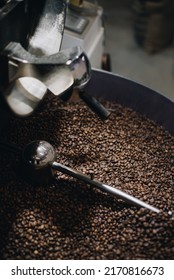 industrial coffee roasting machine mixer during operation full of roasted arabica coffee beans