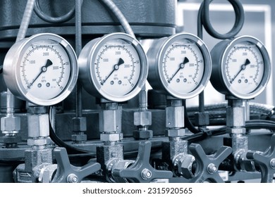 Industrial  concept. equipment of the boiler-house, - valves, tubes, pressure gauges, thermometer. Close up of manometer, pipe, flow meter, water pumps and valves of heating system in a boiler room. - Powered by Shutterstock