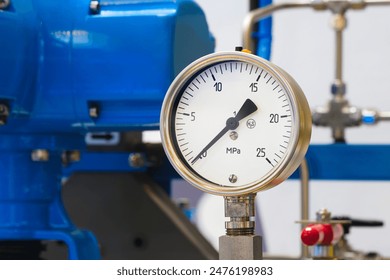 Industrial  concept. equipment of the boiler-house, - valves, tubes, pressure gauges, thermometer. Close up of manometer, pipe, flow meter, water pumps and valves of heating system in a boiler room. - Powered by Shutterstock