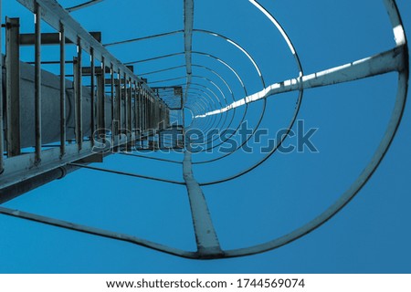 Similar – wooden platform with blue posts with ropes and orange lifebuoys on the background of the sea and sky with clouds Egypt Dahab South Sinai