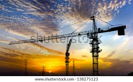 The sun sets and the cranes rise