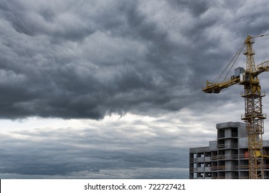 Industrial construction cranes and building site over stormy sky. grunge filter photo - Powered by Shutterstock