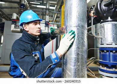 Industrial Construction Worker At Boiler Room Pipe Heat Insulation Work