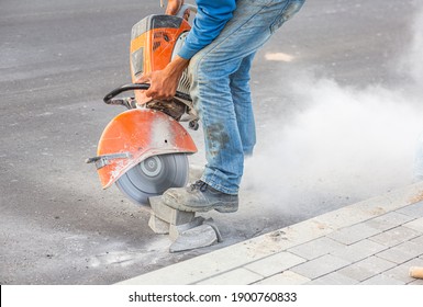 Industrial construction worker using a professional angle grinder.Industrial construction worker using a professional angle grinder. - Shutterstock ID 1900760833