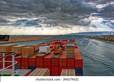 Industrial Container Ship Passing Through Suez Canal With Ship's Convoy, View On The Bow From The Captain Bridge.