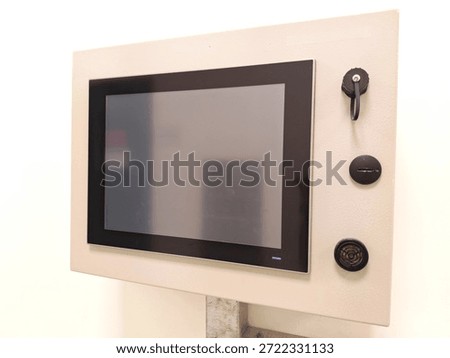 Industrial control panel with touchscreen interface in modern facility