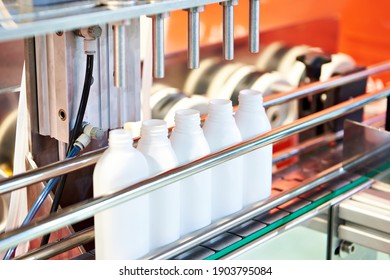 Industrial Conveyor With Plastic Bottles On Dispenser Line