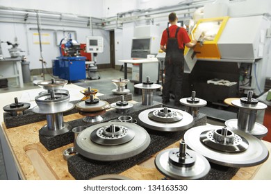 industrial cutting tools in front of cnc milling machine center in tool workshop manufacturing