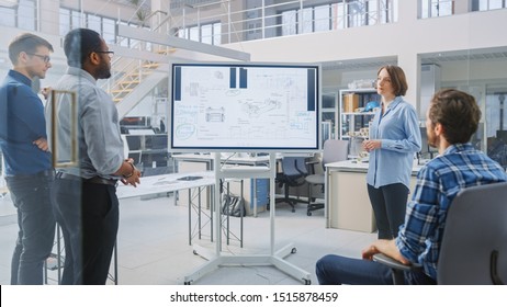 In the In Industrial Design Facility Team of Engineers and Technicians have a Meeting, Female Specialist Leads Briefing, Talks and Draws on Digital Interactive Whiteboard with Car Prototype Concepts - Shutterstock ID 1515878459