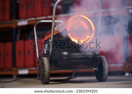 Industrial diesel heater burning isolated with a blurred background