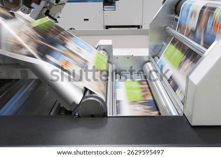 Industrial digital printer working on paper reel                             