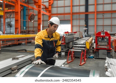 Industrial diligent worker safeguarded by a hard hat, engrossed in his duties amidst the complex machinery of a bustling factory. - Powered by Shutterstock