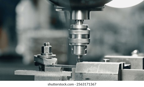 Industrial drill press rapidly perforating a metal component within a manufacturing facility, showcasing precision engineering and automated production processes - Powered by Shutterstock