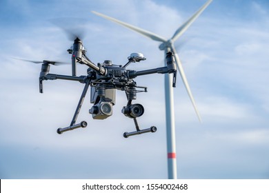 Industrial drone equipped with two cameras for inspection of rotor blades on wind turbines