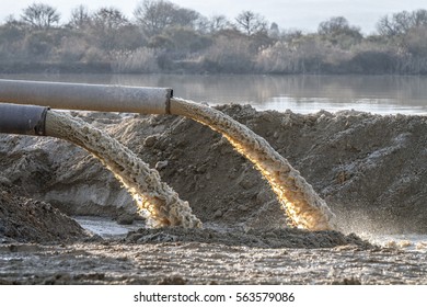 industrial effluent, pipeline discharging liquid industrial waste into a river
