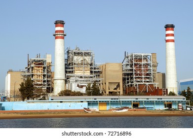 Industrial Electrical Power Plant At The Edge Of A River