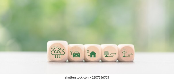 Industrial Emissions Pollute The Environment And Ecosystems. Including Climate Change Carbon Renewable Energy Agreement Reduce Greenhouse Gas Emissions ,icon And Wooden Blocks On Table