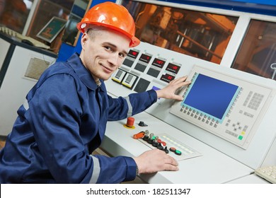 Industrial Engineer Worker Operating Control Panel System At Modern Manufacture Plant