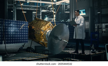 Industrial Engineer Working On Artificial Satellite Construction. Aerospace Agency: Scientist Using Laptop Computer To Develop Spacecraft For Space Exploration And Data Communication.